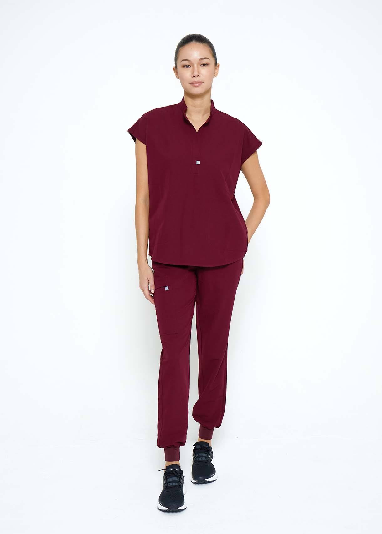 Model wearing scrubs.