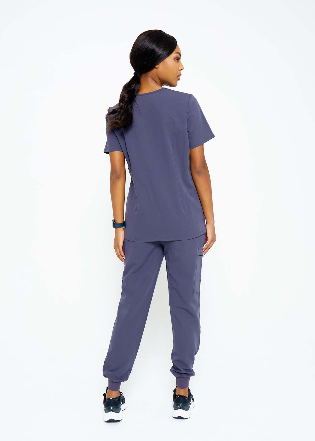 Model wearing scrubs.