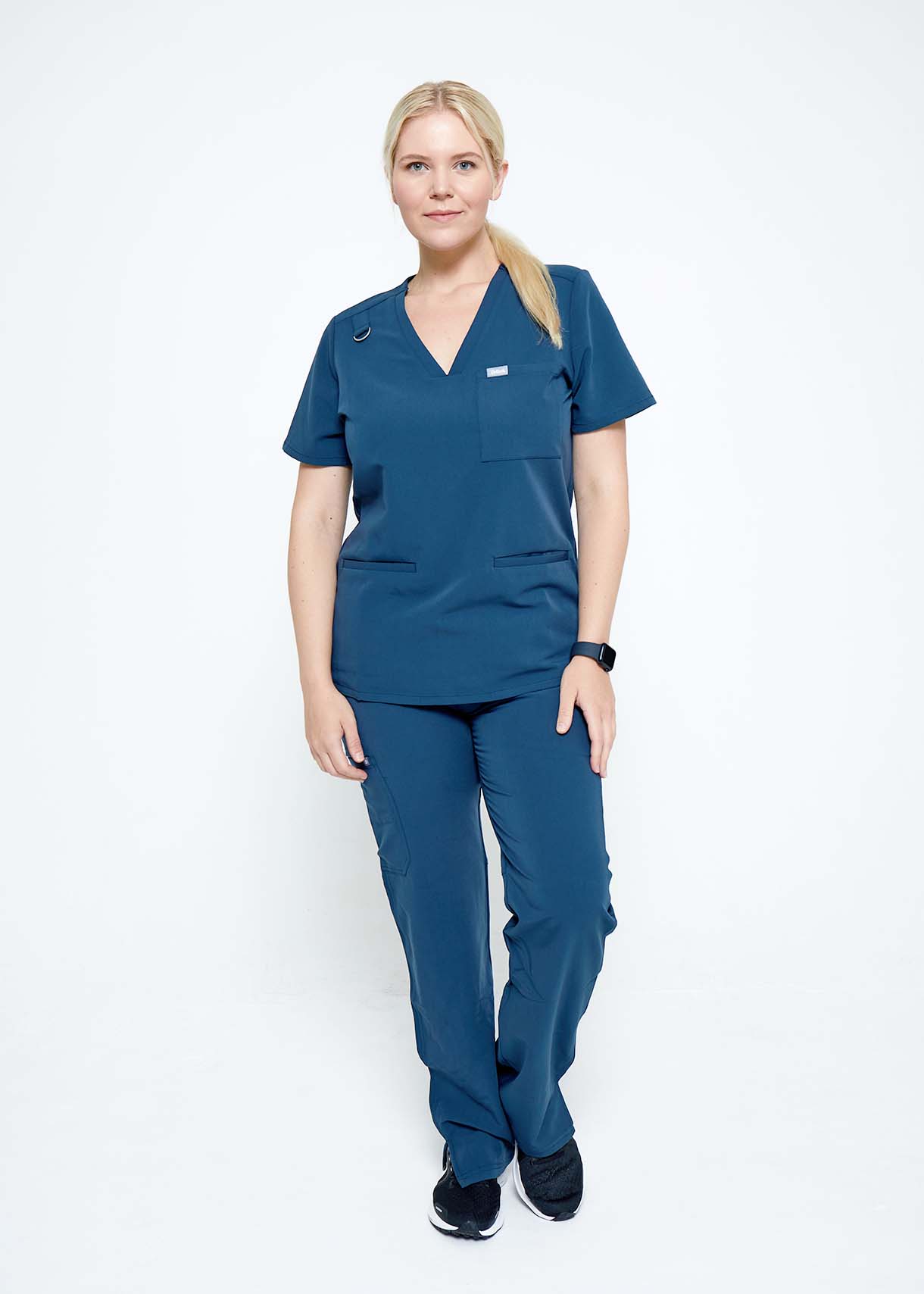 Model wearing scrubs.