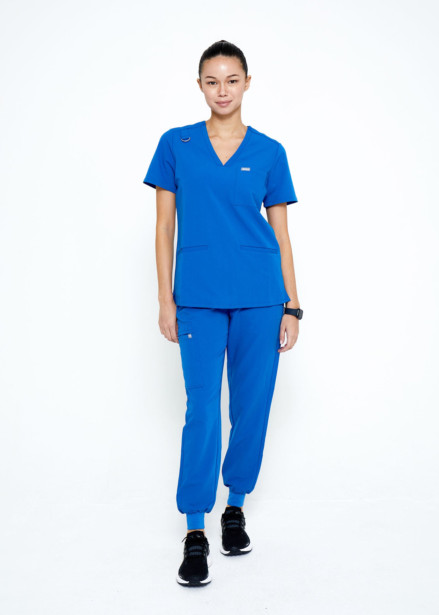 Model wearing scrubs.