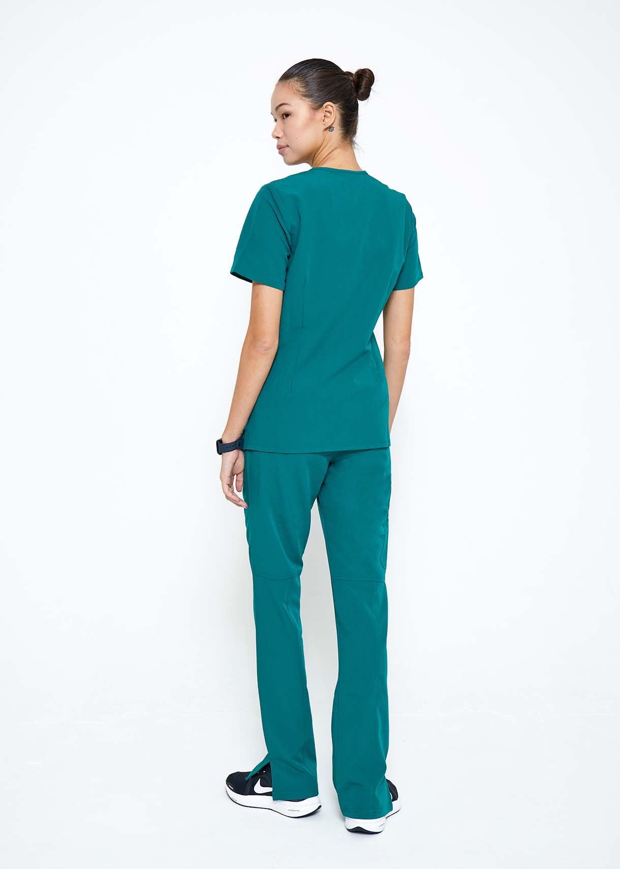 Model wearing scrubs.