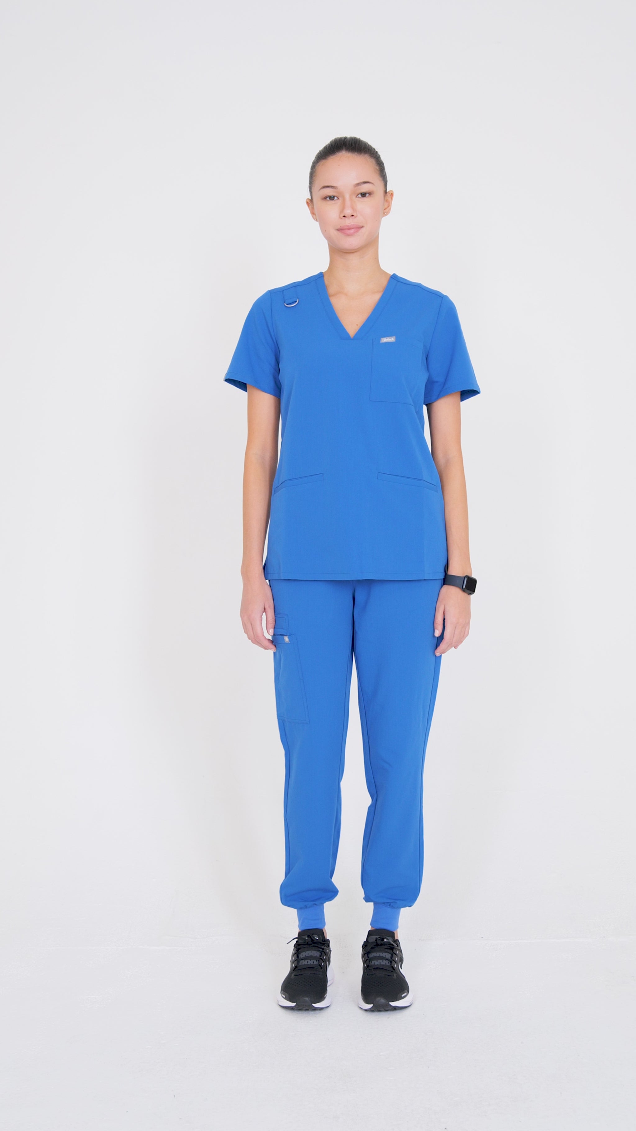 video of model walking in scrubs.